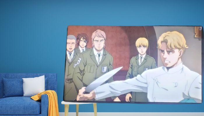Seitenansicht eines Fernsehers neben einem grauen Sofa